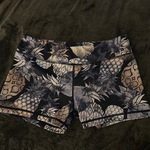 Women’s spandex short shorts, size L, blue, white and gray with pineapples.